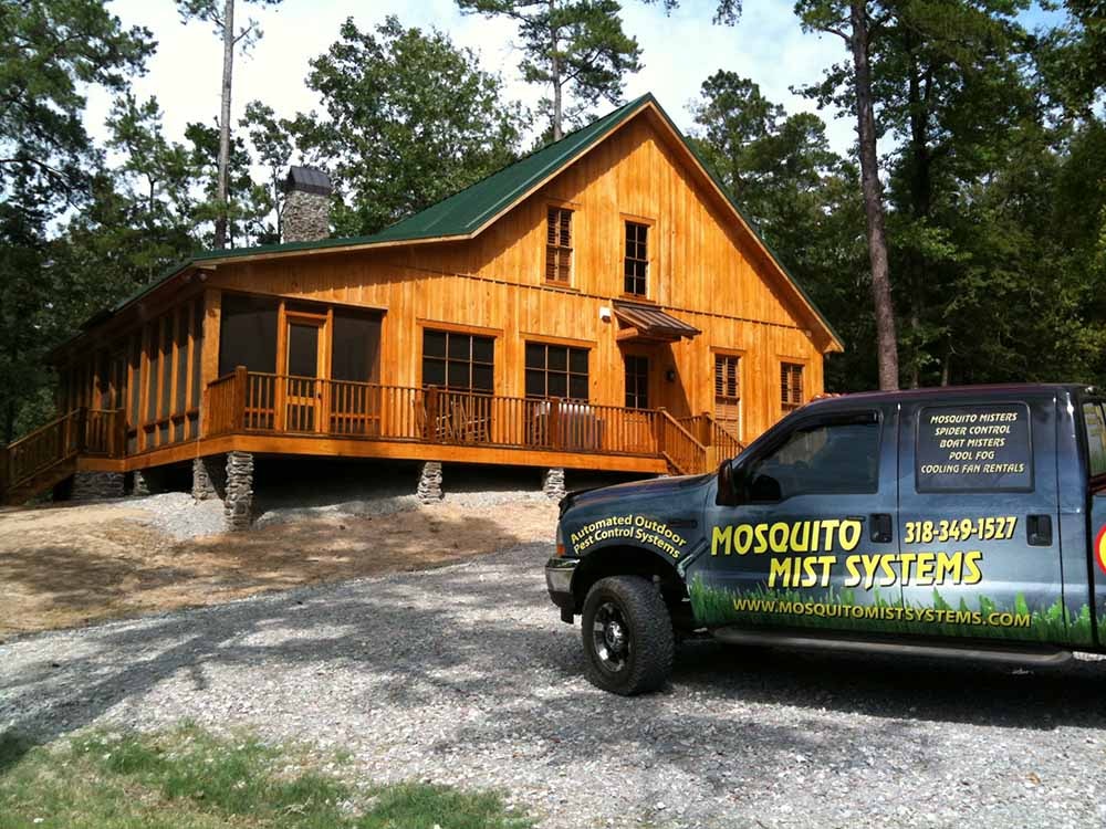 Mosquito Mist Systems service truck at cabin